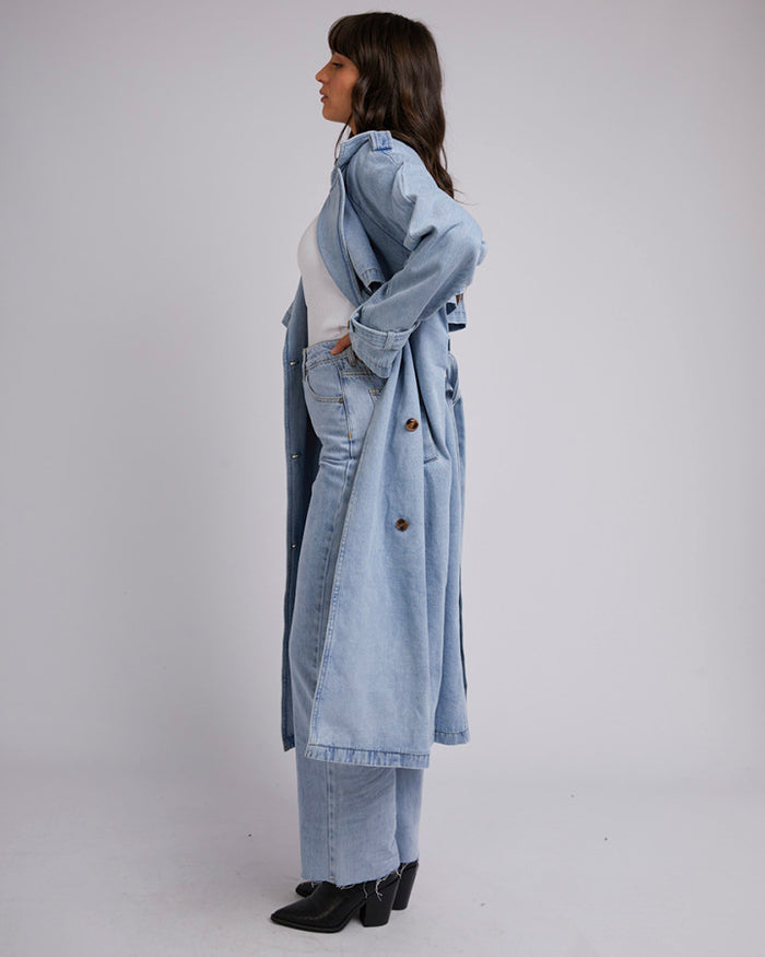 Light wash denim trench coat with wide lapels