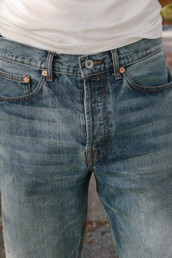 Close-up of blue jeans with a blurred background