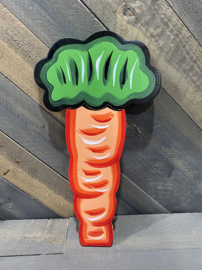 big orange carrot with green bunch on the top