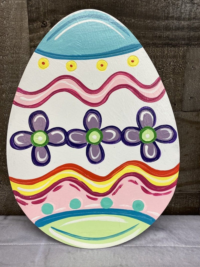 colorful easter egg with flowers and red squiggles