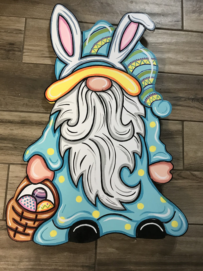 A colorful wooden Easter gnome figure with a basket of eggs, suitable for painting and customization.