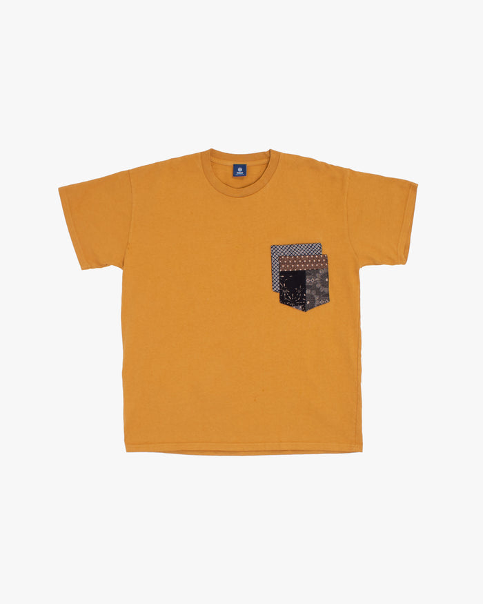 Mustard tee with indigo shibori and charcoal patchwork by Kiriko Made