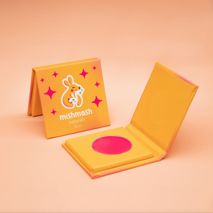 Yellow makeup case with pink blush on a peach background, featuring the mishmash Naturals brand.