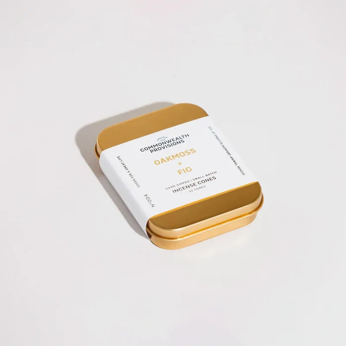 Gold tin of Oakmoss x Fig incense cones by Commonwealth Provisions on white background