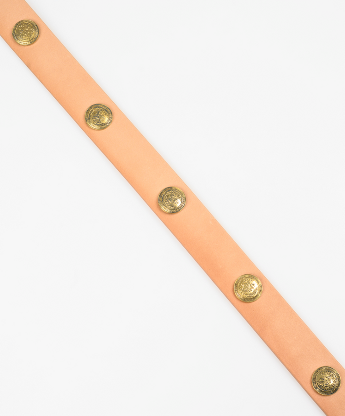 Beige leather belt with gold metal buttons on a white background