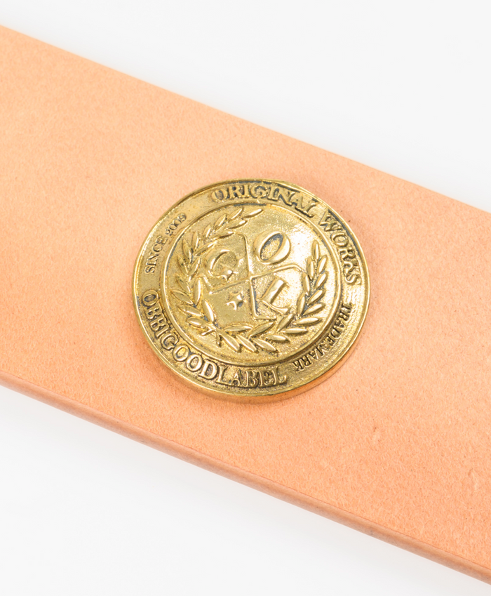 Beige leather belt with a gold buckle on a white background