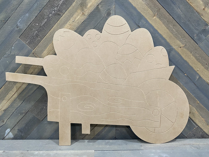 blank yard sing with etches of the wheelbarrow and easter eggs ready to paint
